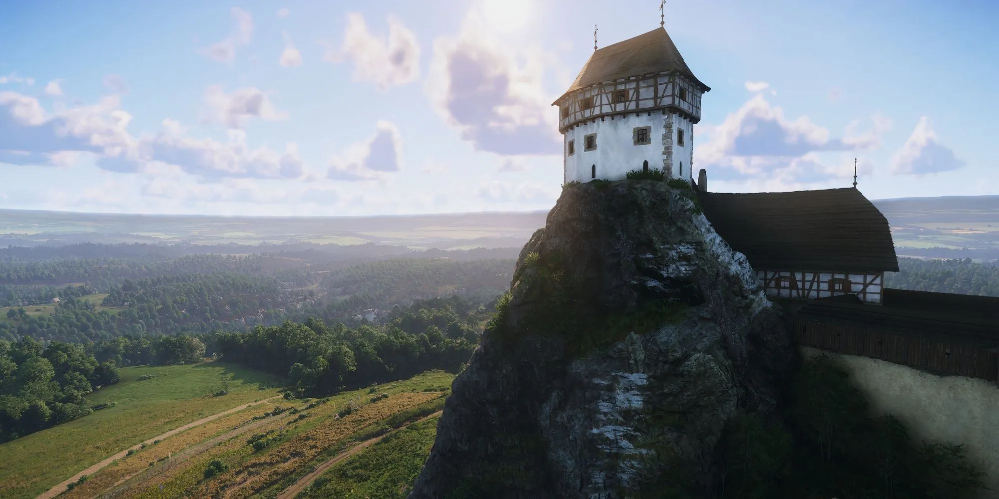 Một tòa nhà lớn nổi bật giữa thế giới rộng lớn của Kingdom Come Deliverance 2, đóng vai trò là địa danh quan trọng để người chơi định hướng trong chế độ không bản đồ.